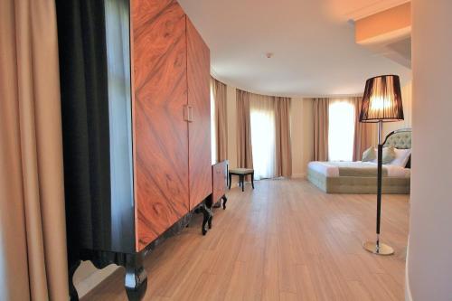 a living room with a large wooden entertainment center at Residence House Ruse in Ruse