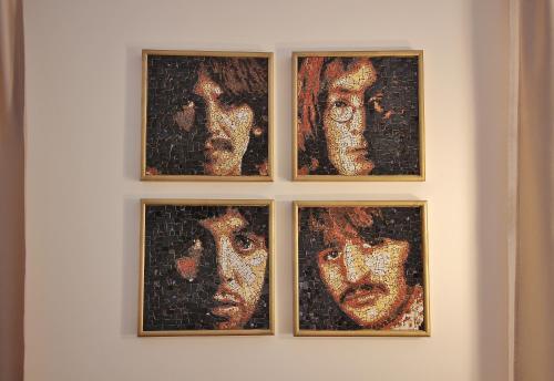 a group of four pictures of a woman on a wall at Residence House Ruse in Ruse
