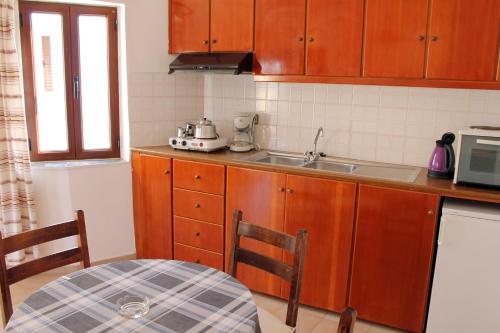Kuchyň nebo kuchyňský kout v ubytování Flamingo Apartments