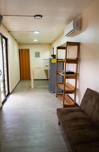 a living room with a couch and a table at Good Vibes Apartments in Talamanca