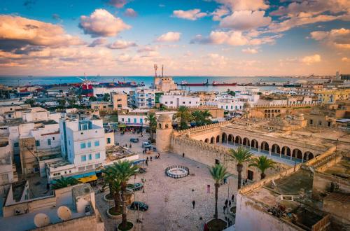 an aerial view of a city with buildings at باردو الحناية in Tunis