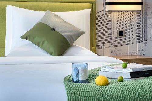 Ένα ή περισσότερα κρεβάτια σε δωμάτιο στο Yizhi Hotel - Guangzhou Zhujiang New Town Huashi Subway Station Branch Free shuttle buses at the Canton Fair