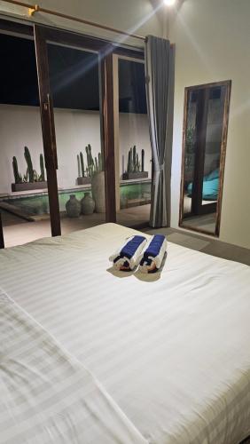 Cama o camas de una habitación en Lunna Villa