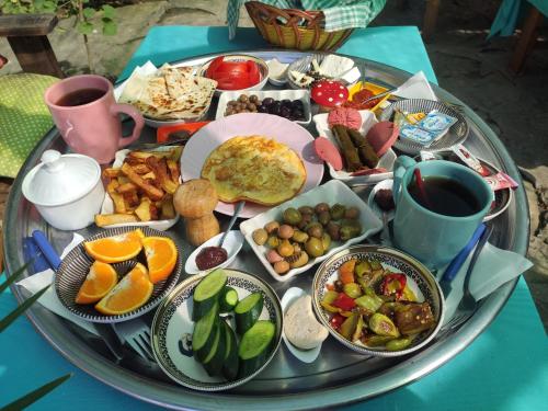 a tray of food on top of a table at Side Tuana Garden Home in Side