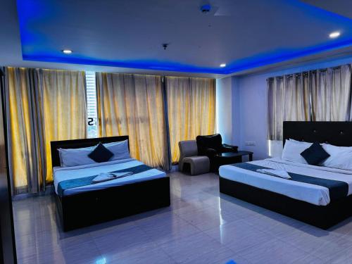 Katil atau katil-katil dalam bilik di Wildwings hotel