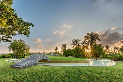 a rendering of a water feature on a golf course at Jawakara Islands Maldives in Lhaviyani Atoll
