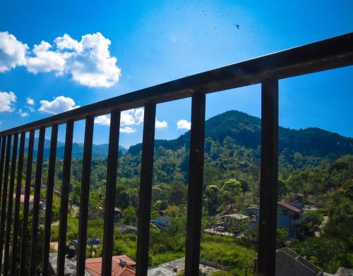 a view of the mountains from a balcony at Ever Breeze Ella Hotel in Ella