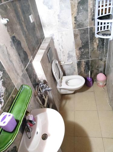 a small bathroom with a sink and a toilet at Side Tuana Garden Home in Side