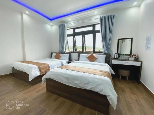 Postel nebo postele na pokoji v ubytování Hotel Duy Dũng - Đà Lạt