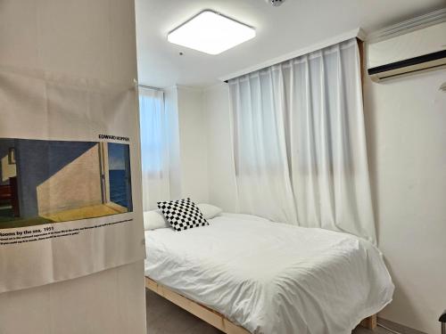 Postel nebo postele na pokoji v ubytování Coco Stay
