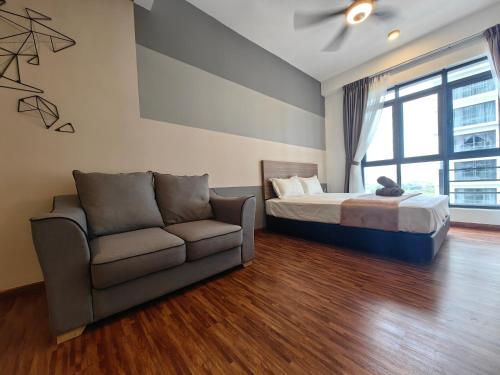 a bedroom with a bed and a couch and a window at Near Airport K Avenue Family Room in Donggongon