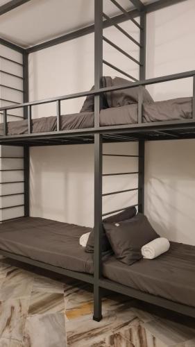 two bunk beds sitting in a room with at Luxpro Luxury Villa / Seremban 2 / Private Swimming Pool in Seremban