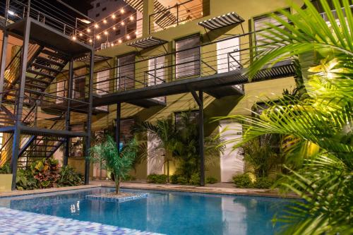 an indoor pool in a building with plants at OASIS TROPICAL HOTEL in Santa Marta