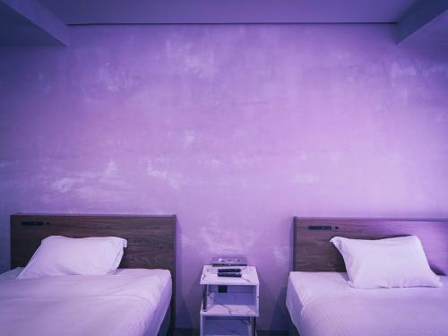 Postel nebo postele na pokoji v ubytování maejima Hotel