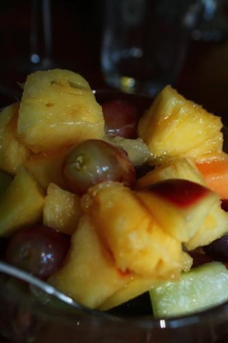 a bowl of fruit with grapes and other fruits at Umoya in Hilton