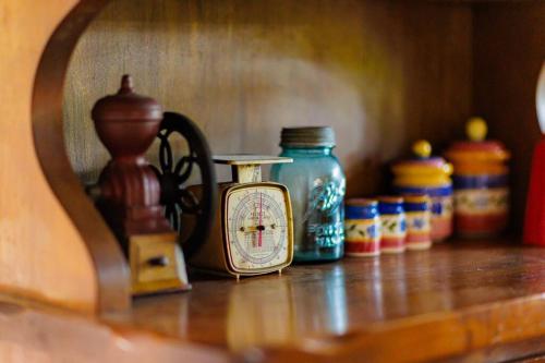 a shelf with different colored jars on a table at レイドバックシャレー in Hakuba