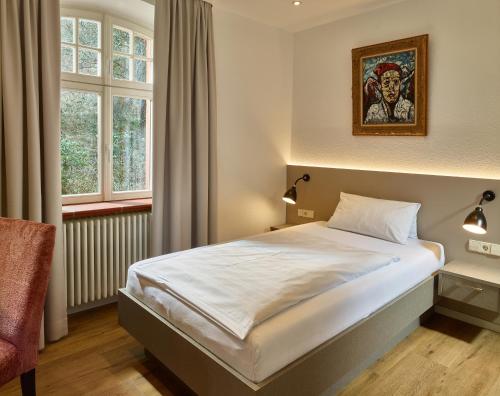 Postel nebo postele na pokoji v ubytování Hotel & Restaurant Burgschänke