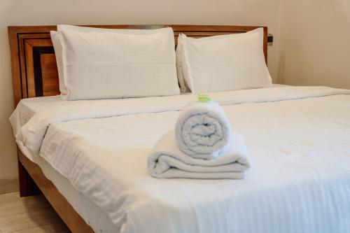 a towel animal sitting on top of a bed at Tony's beach house in Calangute