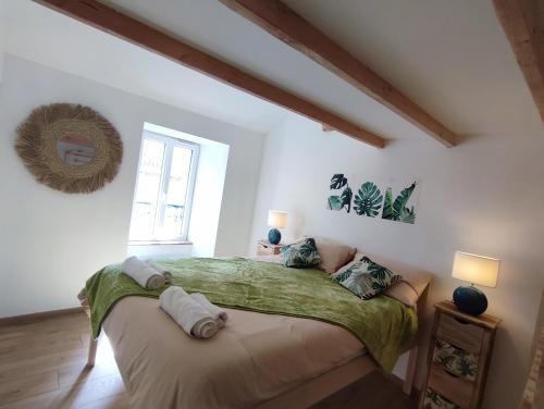 Postel nebo postele na pokoji v ubytování Les randonnées joyeuses