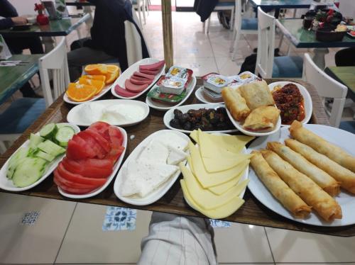 a table filled with different types of breakfast foods at Bereket traveler Hotel in Istanbul