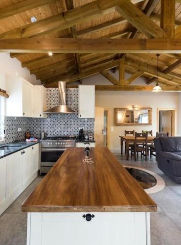a kitchen with a wooden counter top in a room at Quinta Boa Vida in Alcobaça