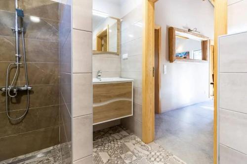 a bathroom with a shower and a sink at Quinta Boa Vida in Alcobaça