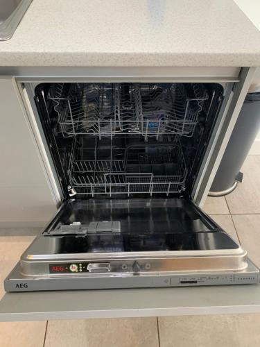 an oven with a dish rack in it at The Chestnuts in Winscombe