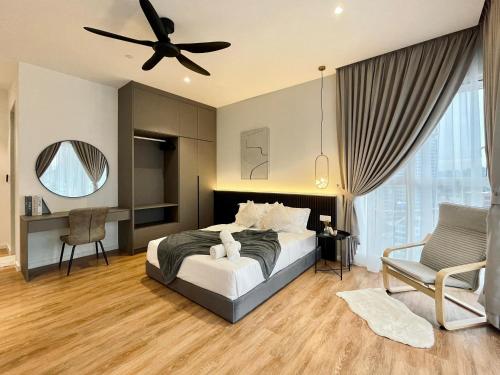 a bedroom with a bed and a ceiling fan at QUILL RESIDENCE 1018 in Kuala Lumpur