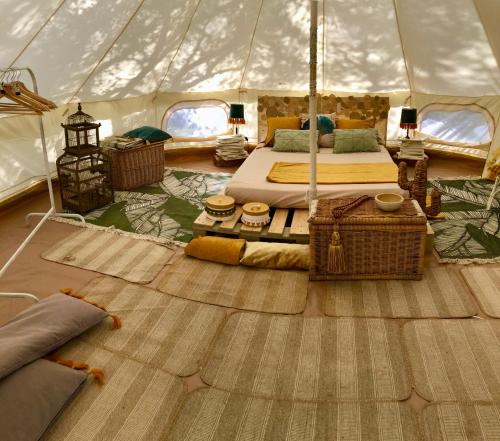 a bedroom with a tent with two beds in it at Glamping - La Casa del Piano in Chiclana de la Frontera