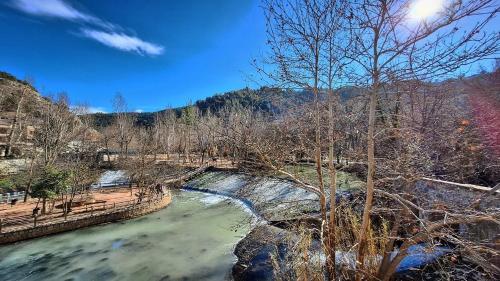 a river with a bridge over a river at Gaiamoment,com - Cueva las reinas in Alcalá del Júcar