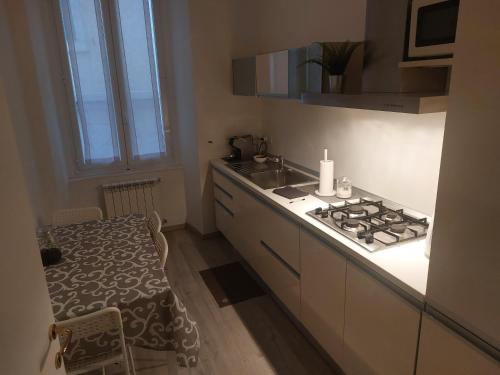 a kitchen with a stove and a counter top at Torrebianca in Trieste