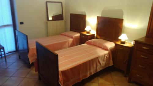 Ліжко або ліжка в номері La Casa Di Baba'