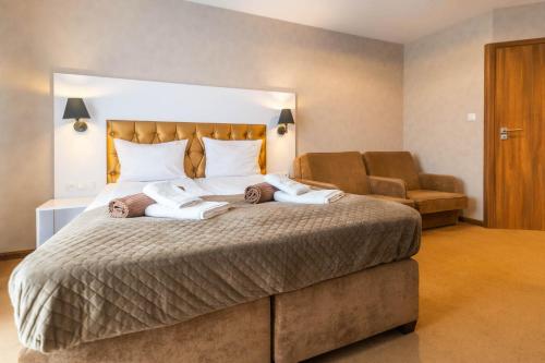 Ένα ή περισσότερα κρεβάτια σε δωμάτιο στο Amber Park Spa