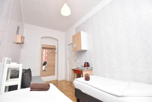Katil atau katil-katil dalam bilik di City Central Hostel - Pokoje prywatne