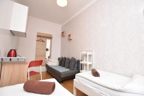 Katil atau katil-katil dalam bilik di City Central Hostel - Pokoje prywatne