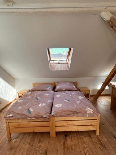 a bedroom with a bed in a room with a window at private house in Ústí nad Labem