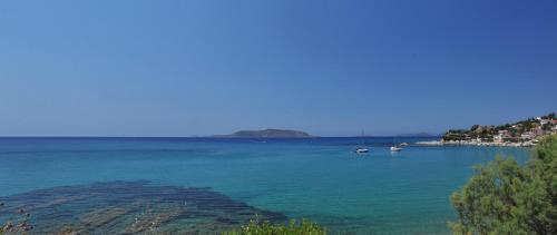 a large body of water with boats in it at Apartments Korakakis Beach in Finikounta