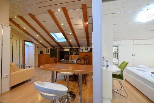 a kitchen and dining room with a table and chairs at Apartment Eva in Zadar