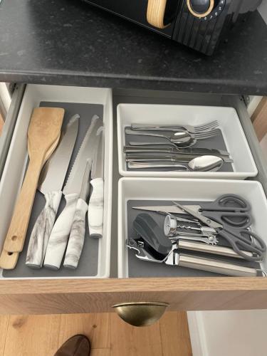 a drawer filled with utensils in a kitchen at Godden Green B & B Guesthouse in Newchurch
