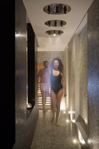 a man and a woman walking down a hallway at Hotel Continental in Sorrento