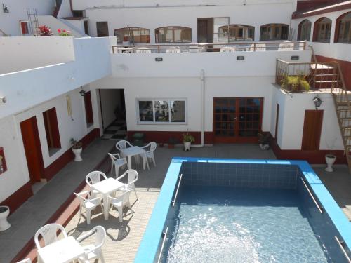 a view from the balcony of a house with a swimming pool at Hotel Santa Clara in Termas de Río Hondo