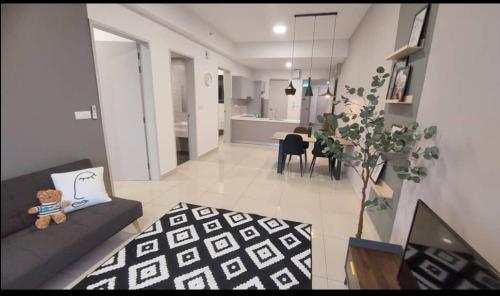 a living room with a teddy bear sitting on a couch at Luxury accommodation in Pantai Cenang