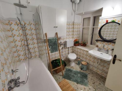 a bathroom with a tub and a toilet and a sink at Thalgiron, a breath away from Delphi in Ámfissa