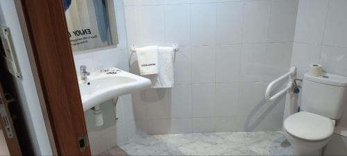 a bathroom with a sink and a toilet at Hostal Europa in Tarragona