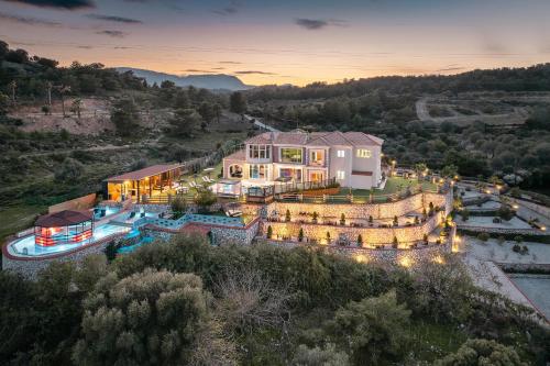 an aerial view of a large house with a pool at Paramithia Villa in Afantou