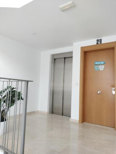 an office building with two elevators and a door at Appartamento Sol in Puerto del Rosario