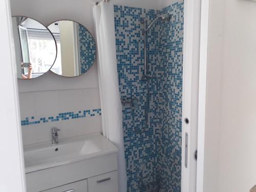a bathroom with a shower and a sink and a mirror at Bellavista in Torre dell'Orso