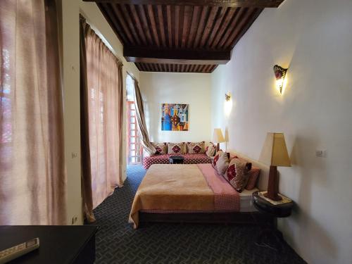 a bedroom with a large bed in a room at chez youssef in Fez