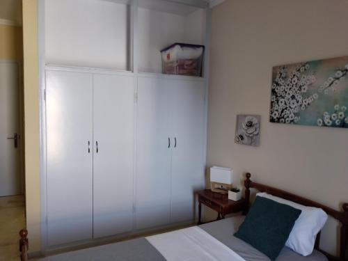 Postel nebo postele na pokoji v ubytování Jimmy's Apartments