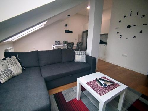 a living room with a couch and a table at Zemun blue star in Zemun